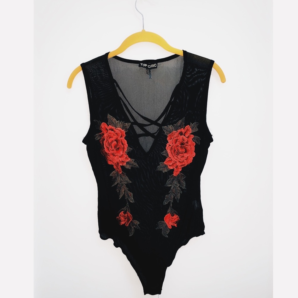 Black body suit with roses on it. Stunning!